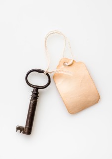 Antique key with tag.