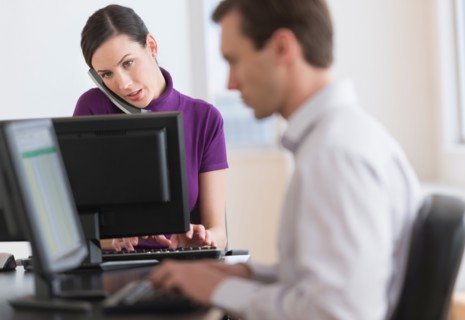 Office workers using computers.