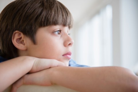 Portrait of pensive boy (8-9)