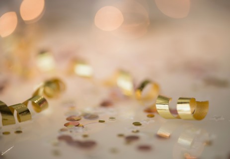 Close-up of gold streamer and confetti