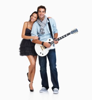 Studio Shot, Young woman embracing guitarist