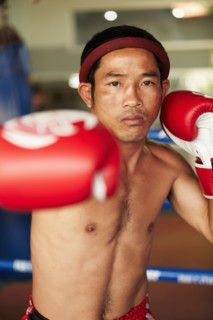 Portrait of mid adult male boxer in fighting stance