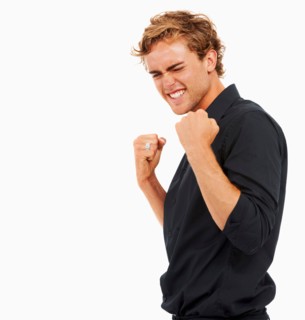 Studio Shot, Portrait of young man with arms raised and clenched fists