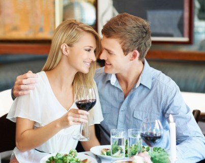 Couple drinking wine in restaurant