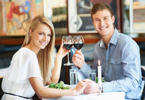 Couple drinking wine in restaurant