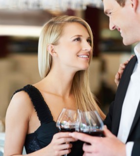 Couple drinking wine in restaurant