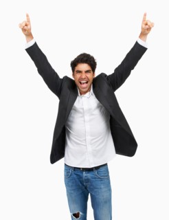 Studio portrait of stylish man celebrating