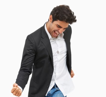 Studio portrait of stylish man cheering
