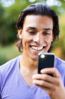 Portrait of young man using mobile phone