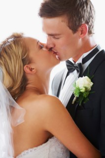 Bride and groom kissing
