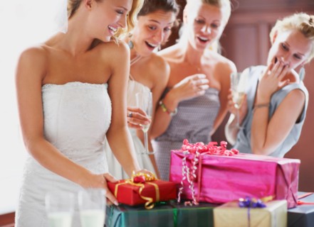 Bride  and bridesmaids unpacking gifts