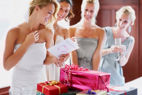 Bride  and bridesmaids unpacking gifts