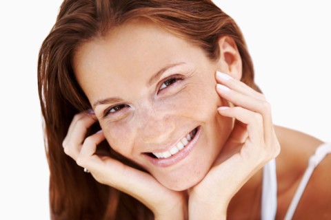 Studio portrait of woman smiling