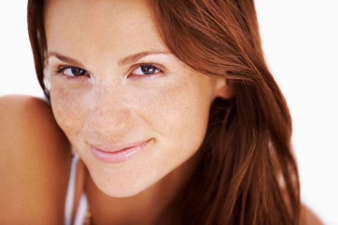 Studio portrait of woman smiling