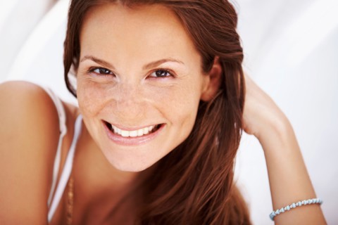 Studio portrait of woman smiling