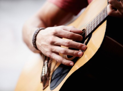 Man playing guitar, close-up
