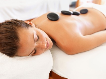 Woman getting lastone therapy in spa