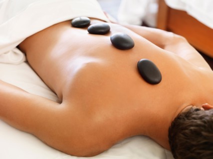 Man getting lastone therapy in spa