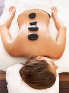 Woman getting lastone therapy in spa