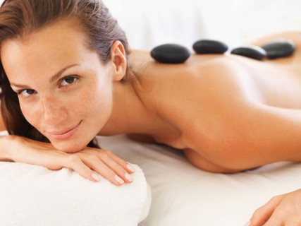Woman getting lastone therapy in spa