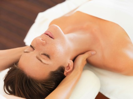 Woman receiving massage in spa