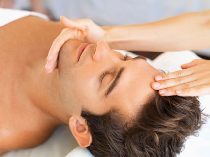 Man receiving massage in spa