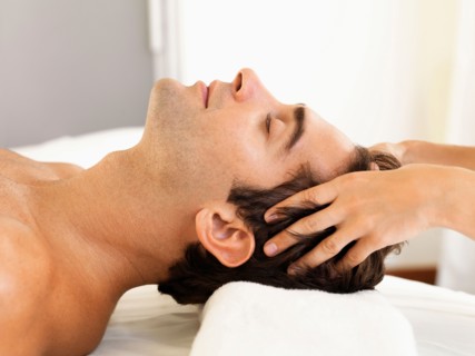 Man receiving massage in spa