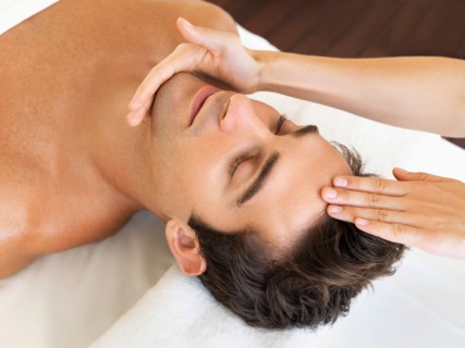Man receiving massage in spa