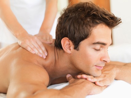 Man receiving massage in spa