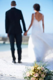 Newlywed couple on beach