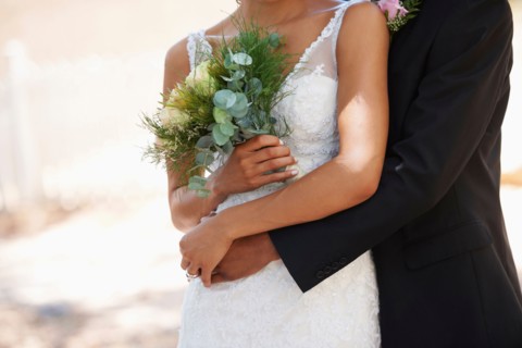 Newlywed couple embracing