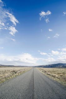 Road going through desolate landscape