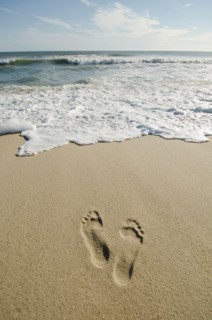 Footprints on sandy beach