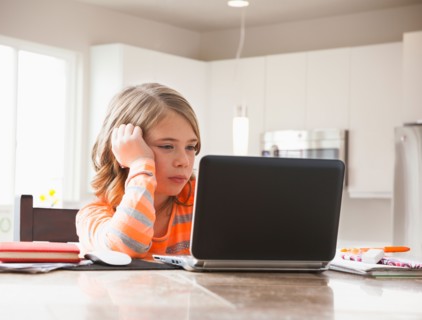 Girl (6-7) doing homework