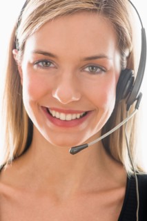Studio portrait of young woman wearing headset.