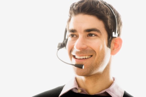 Studio portrait of man wearing headset.
