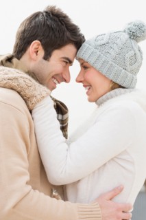 Profile of couple in winter clothing.
