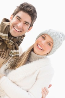 Portrait of couple in winter clothing.