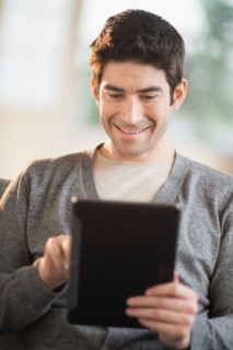 Man using tablet pc.