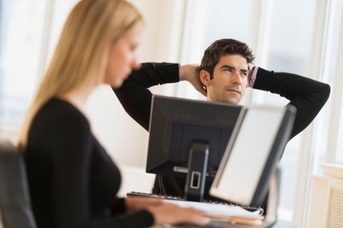 Business man and woman working in office.
