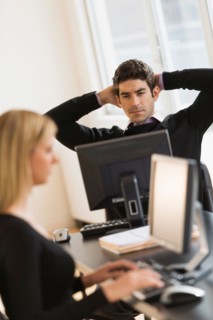 Business man and woman working in office.