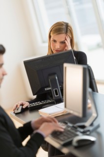 Business man and woman working in office.