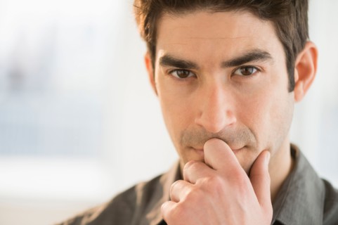 Studio portrait of mid adult man.