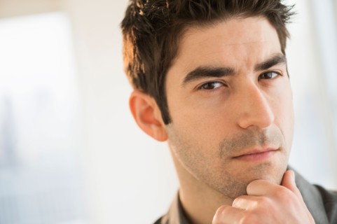 Studio portrait of mid adult man.