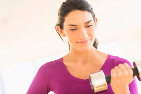 Woman lifting dumbbell.