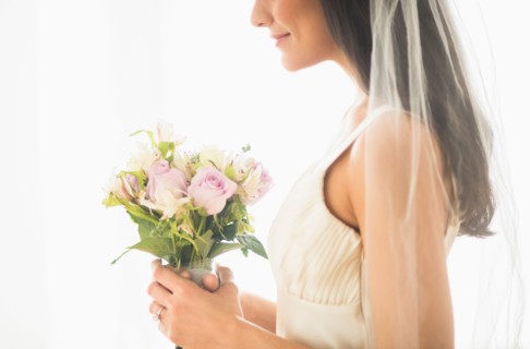 Bride holding bouquet.