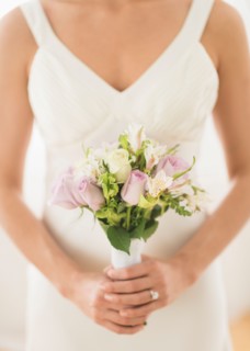 Bride holding bouquet.