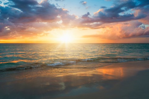 Sun setting over sea. Jamaica.