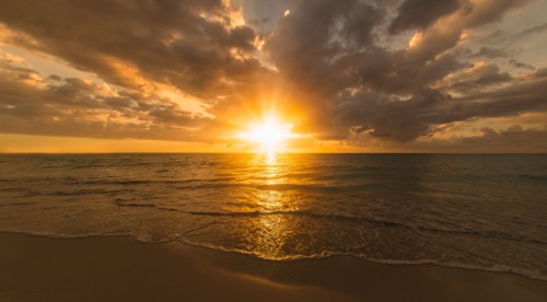 Sun setting over sea. Jamaica.