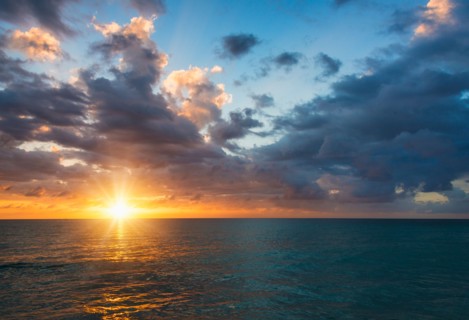 Sun setting over sea. Jamaica.